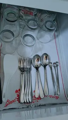 a group of silver utensils sitting on a table at Tessa's Place Staycation in Biñan