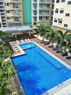 an overhead view of a swimming pool in a building at Tessa's Place Staycation in Biñan