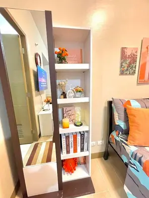 a mirror in a room with a bed and a bedroom at NAIA T3 Two Palmtree Villas 3-5mins away from Resorts World Casino Manila in Manila