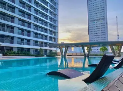 a swimming pool in the middle of a building at fame residence staycation in Manila