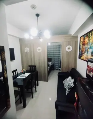 a living room with a couch and a table at Casa Arville in Manila