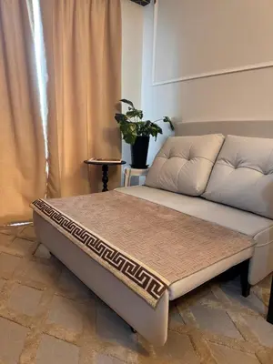 a bed in a room with a couch at Mon Amour Haven in Taytay