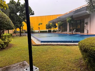 a swimming pool in a yard next to a building at Mon Amour Haven in Taytay