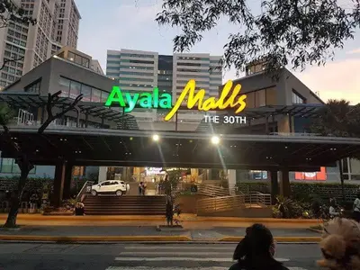 aania malls sign on top of a building at Mariels Staycation in Manila