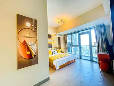 a bedroom with a bed and a large window at Ultra-Luxury 3BR Penthouse in Uptown BGC in Manila