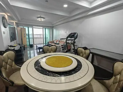 a dining room with a table and chairs at Tranquil Harbor in Manila