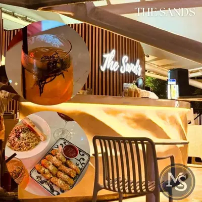 a table with a plate of food and a drink at Azure Residences Bahamas good for 3 pax in Manila