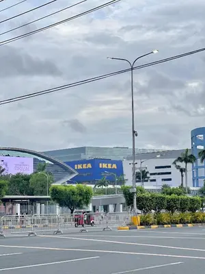 a street light on the side of a city street at Sea Residences 2BR Pool View Unit for 4-8 pax - Beehive Stay MOA in Manila