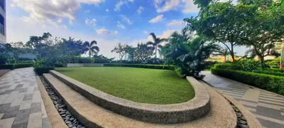 a park with a large grassy field with trees at Modern-Studio with Balcony Stunning View in Manila