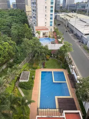 an overhead view of a swimming pool in a city at Laidback Cavern at Studio City Alabang in Manila