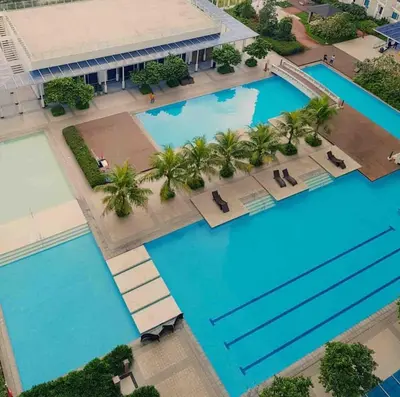 an overhead view of two pools in a resort at Family Suites- Self Service Condo Unit in Jazz Residences Makati in Manila