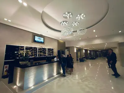 a group of people standing in a hotel lobby at Sea Residences 2 BR by TVANS in Manila
