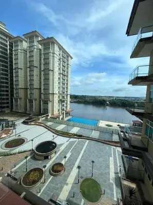 arial view of a city with buildings and a body of water at Diamond Studio in Manila