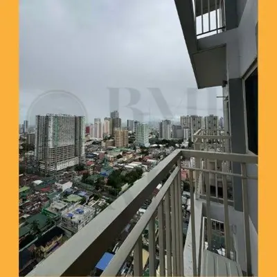 a view of a city from a balcony of a building at Staycation Manila at Coast Residences in Manila