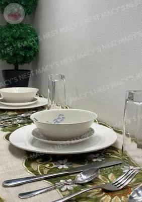 a table with a bowl and plates and silverware at Macy's Nest - Shore 2 Tower 1 in Manila