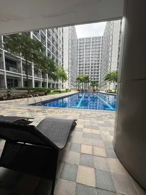 a view of a swimming pool in a building at Shore 2 Residences Tower 1 in Manila