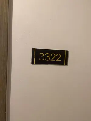 a refrigerator door with a temperature sign on it at FX Condotel 3322 in Manila