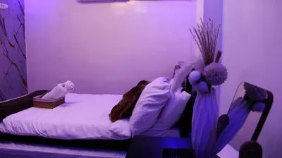 a bedroom with a bed in a room with purple lighting at Phoenix Bliss - Amber in General Trias