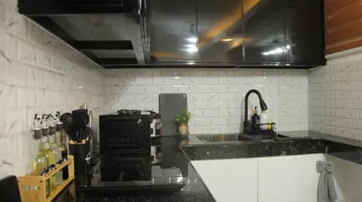 a kitchen with a sink and a stove at Phoenix Bliss - Amber in General Trias