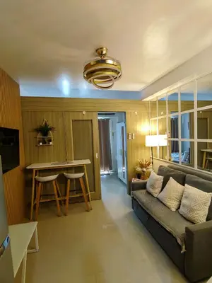 a living room with a couch and a table at Mk Luxury Vacation in Manila