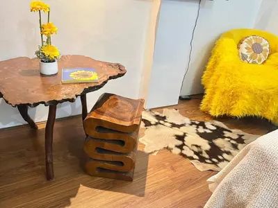 a living room with a table and a table sidx sidx sidx at Julie Annes Guesthouse in the Heart of the City in Manila