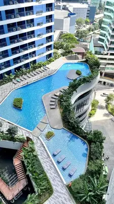 an overhead view of a building with two pools at Air Residence Makati in Manila