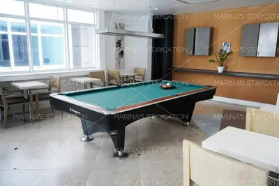 a room with a pool table in a restaurant at Beautiful 1-Bedroom Condo in Makati - Pool, Gym & Near Airport in Manila