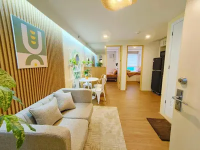 a living room with a couch and a table at 2BR Pasig Condo for Family or Group with Parking in Manila