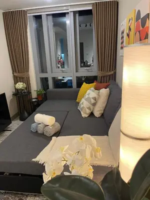 a bedroom with a bed with towels on it at Funky HQ - 1BR Eastwood Global Plaza in Manila