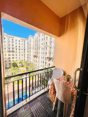 a balcony with a view of a building at Pinecrest Residential Condominium Newport Pasay City in Manila