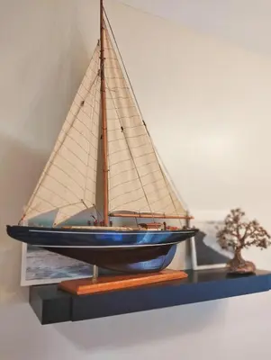 a model of a sail boat on a shelf at Flair Towers Urban Resort Staycations in Manila