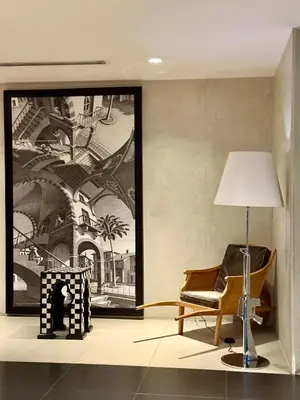 a living room with a chair and a lamp at Studio Unit Staycation near Rockwell Mandaluyong FREE Pool Access in Manila
