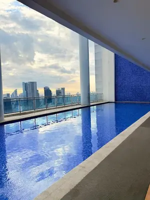 a swimming pool on the roof of a building at Studio Unit Staycation near Rockwell Mandaluyong FREE Pool Access in Manila