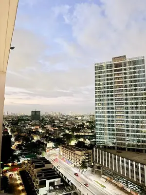 a view of a city with a tall building at Studio Unit Staycation near Rockwell Mandaluyong FREE Pool Access in Manila