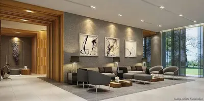 a lobby with a couch and chairs in a room at Happy Home Haven At S Residences Moa in Manila