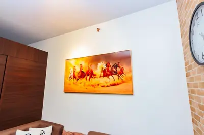 a painting of a painting of horses on a wall at Serene City Stay Trendy Cozy Makati Condo Fun Swim Gym Netflix 4047 in Manila