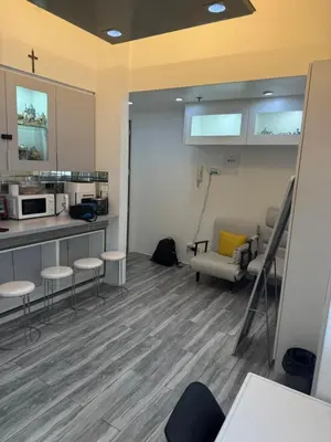 an office with a kitchen and a waiting room at Greenhills shopping center 2BR condominium in Manila