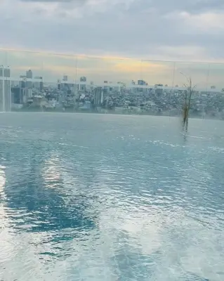 a body of water with a city in the background at Gramercy Residences Spacious 1 BR Loft FREE Amenities in Manila
