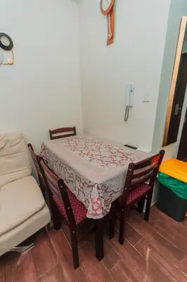 a table and chairs with a table and a table and a chair at The Quirk Inn Air residence Makati Swim Gym Park Eat Laugh 3301 in Manila