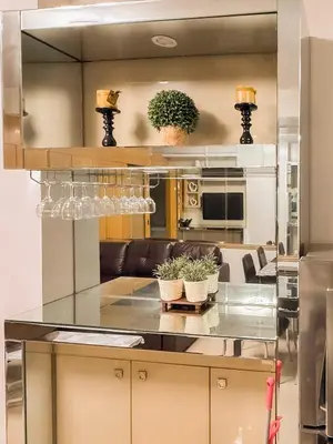 a kitchen with a table with two potted plants on it at 907 Air Condo Urban Retreat 1BR w City View MOA in Manila