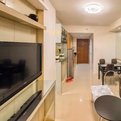 a living room with a large flat screen tv on a wall at 907 Air Condo Urban Retreat 1BR w City View MOA in Manila