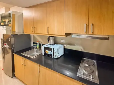 a kitchen with a sink and a toaster on the counter at 907 Air Condo Urban Retreat 1BR w City View MOA in Manila