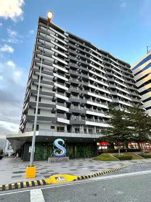 a large apartment building with a sign in front of it at Sonens Hem S Residences in Manila