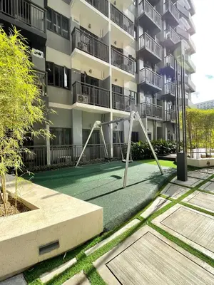 a playground in front of a apartment building at Sonens Hem S Residences in Manila