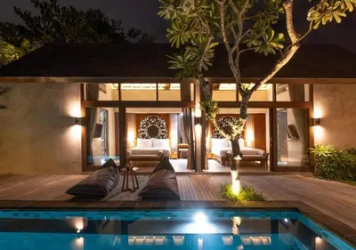 a villa with a swimming pool at night at warda private villa in Pasong Bayog