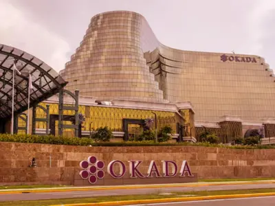 a building with the olympia sign in front of it at Casa Josefina in Manila