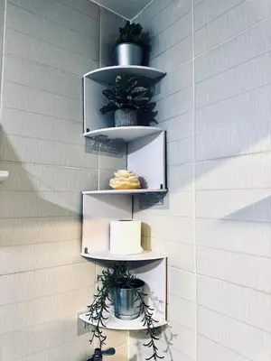 a wall with shelves with potted plants on them at Exquisite 2 Bedroom Suite in Manila