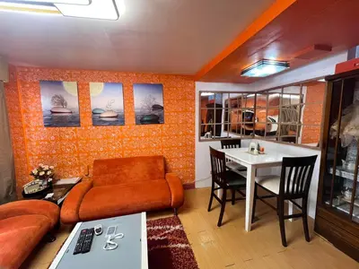 a living room with a couch and a table at Pahingahan in Cainta