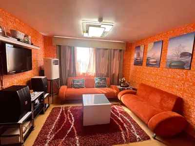 a living room with a couch and a tv at Pahingahan in Cainta