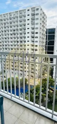 a view of a large apartment building from a balcony at 10th Floor Facing Amenity in Manila